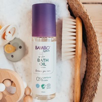 Bambo Nature Bath Oil on a towel in a basket